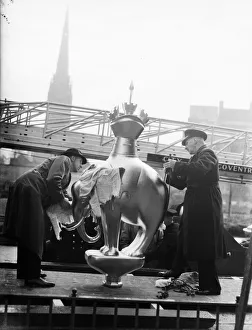 Fireman helps place the Elephant and Castle statue on top of the standard in Broadgate Fireman helps place the Elephant and Castle statue on top of the standard in Broadgate
