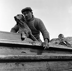 Fisherman George Emmerson with his devoted dog Sandy, pictured at work in Flamborough Fisherman George Emmerson with his devoted dog Sandy, pictured at work in Flamborough