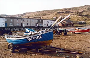 Fishing cobles are drawn up on the sea shore at Skinningrove where once boats arrived to Fishing cobles are drawn up on the sea shore at Skinningrove where once boats arrived to