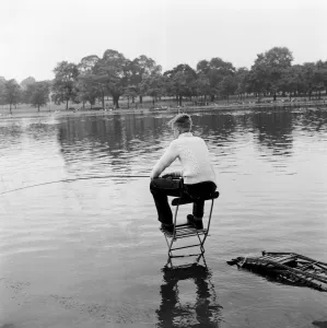Fishing on the Serpentine in London's Hyde Park. 8th August 1957 Fishing on the Serpentine in London's Hyde Park. 8th August 1957