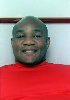 Fomer boxing champion George Foreman in a London hotel resting on bed September 1990