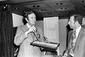 Images Dated 23rd April 1975: Football manager Don Revie accepts his prize at the Tie Manufacturers Association Top Ten