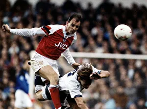 Football player Steve Bould for Arsenal against tackles Teddy Sheringham Football player Steve Bould for Arsenal against tackles Teddy Sheringham