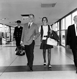 Images Dated 25th June 1970: Footballer Bobby Charlton and his wife Norma leaving Heathrow Airport for Australia