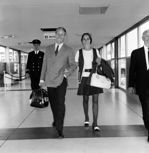 Images Dated 25th June 1970: Footballer Bobby Charlton and his wife Norma leaving Heathrow Airport for Australia