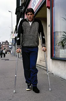 Footballer Ted McMinn in crutches after an injury on the football field September Footballer Ted McMinn in crutches after an injury on the football field September