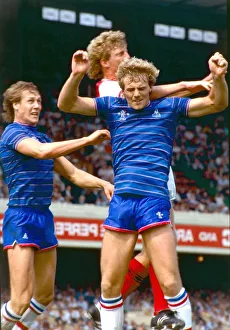 Footballers jumping up for a high ball in the air during the Chelsea v Arsenal football Footballers jumping up for a high ball in the air during the Chelsea v Arsenal football