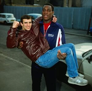 Images Dated 14th March 1983: Frank Bruno boxer 1983 lifting and holding Charlie Magri