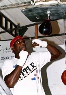 Frank Bruno boxer training with a speed ball