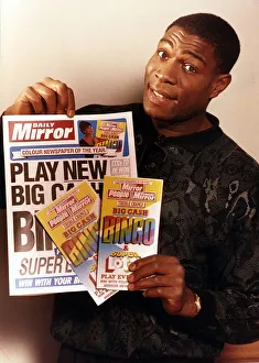 Images Dated 22nd January 1990: Frank Bruno Boxing Holding Mirror news paper and bingo