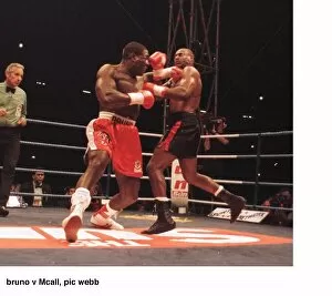 Images Dated 2nd September 1995: Frank Bruno lunges at Oliver McCall with a left Jab during their fight for