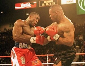 Images Dated 17th March 1996: Frank Bruno and Mike Tyson battle it out during the WBC world title fight in Las Vegas