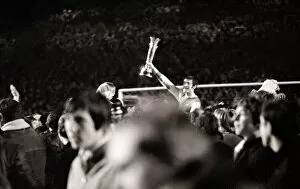 Images Dated 28th April 1970: Frank McLintock helped off the pitch April 1970 holding InterCities Fairs Cup