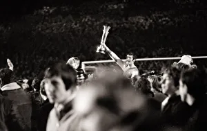 Images Dated 28th April 1970: Frank McLintock helped off the pitch April 1970 holding InterCities Fairs Cup