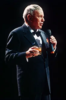Frank Sinatra sings in concert with drink in hand circa 1990 Frank Sinatra sings in concert with drink in hand circa 1990