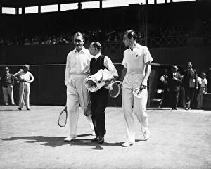 Fred Perry (right) walks out onto the centre court with his opponent Jack Crawford (left