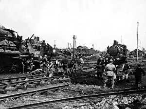 French railway workers helping American soldiers to repair track in Cherbourg 1944 WW2 French railway workers helping American soldiers to repair track in Cherbourg 1944 WW2