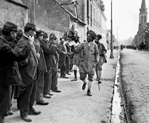 French troops shaking hands and giving floral bouquets to the Indian soldiers as they French troops shaking hands and giving floral bouquets to the Indian soldiers as they