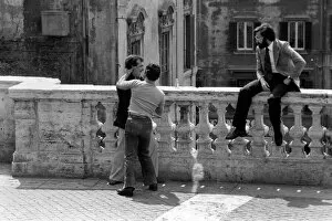 Friends greet each other in a street in the city of Rome, Italy April 1975