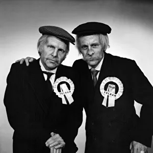Images Dated 15th April 1975: Fulham footballers Bobby Moore (left) and Alan Mullery dressed in suits and make-up