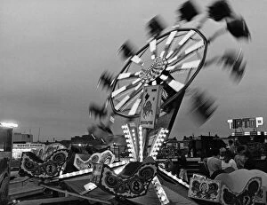Images Dated 31st May 1984: Fun seekers enjoying all the fun of the fair on the Octopus ride at the Clairville Common