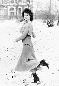 Garielle Drake actress standing in snow covered park January 1985