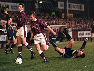 Gary Mackay of Hearts Football Club runs with the ball after tackling Paul Bernard of Gary Mackay of Hearts Football Club runs with the ball after tackling Paul Bernard of