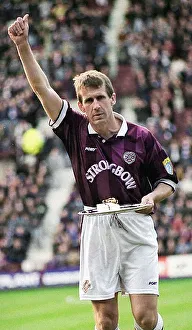 Gary Mackay Hearts footballer receives award for 600 games silver salver arm raised Gary Mackay Hearts footballer receives award for 600 games silver salver arm raised