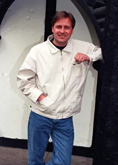 Gary Webster actor leaning against wall white jacket denims clenched fist April 1997 Gary Webster actor leaning against wall white jacket denims clenched fist April 1997