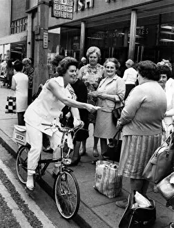 General Election 1970: The Candidate on a Bike. The housewives in the High Street at