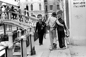 Images Dated 27th April 1975: General scenes in Venice. A couple stroll along the narrow Venetian streets