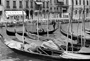 General scenes in Venice. A gondola makes his way along the Grand Canal