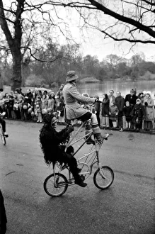 Gentleman in fancy dress seen here riding an unusual tandam bicycle in the Easter parade Gentleman in fancy dress seen here riding an unusual tandam bicycle in the Easter parade