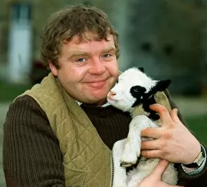 Images Dated 1st April 1982: Geoffrey Hughes holding baby goat April 1982