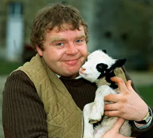 Images Dated 1st April 1982: Geoffrey Hughes holding baby goat April 1982