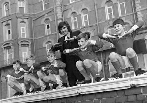 George Best with children from a Manchester children'