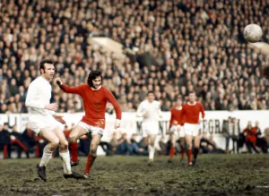 George Best of Manchester United seen here in action against Paul Reaney of Leeds circa George Best of Manchester United seen here in action against Paul Reaney of Leeds circa