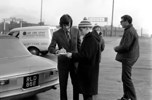 George Best signs autographs and boards the coach at Old Trafford he has just been fined George Best signs autographs and boards the coach at Old Trafford he has just been fined