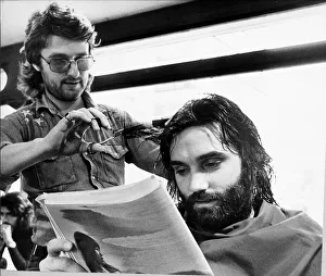 George Bests reads the paper whilst having his haircut May 1974 George Bests reads the paper whilst having his haircut May 1974