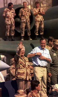 George Bush President of the United States with his wife Barbara waving to American army George Bush President of the United States with his wife Barbara waving to American army