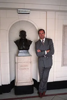 Images Dated 10th July 1989: George Graham former Arsenal manager next to a bust of Herbert Chapman in marble hall of