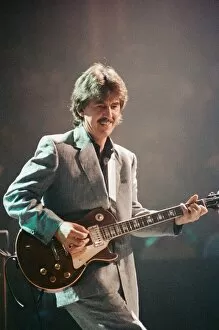 Images Dated 6th October 1992: George Harrison ex Beatles Playing the guitar at the Gary Moore concert at the Royal