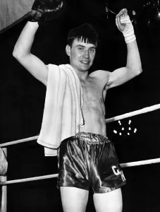 George Hind in the ring with his arms in the air George Hind in the ring with his arms in the air