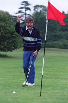 Images Dated 20th June 1995: George King celebrates his scratchcard jackpot on the golfcourse after he