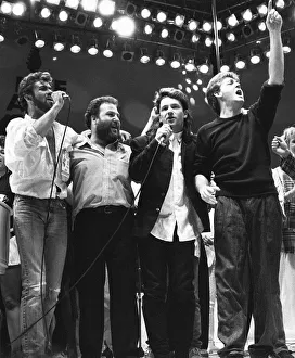 George Michael, Harvey Goldsmith, Bono and Paul McCartney seen here performing Feed George Michael, Harvey Goldsmith, Bono and Paul McCartney seen here performing Feed