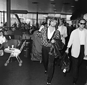 Images Dated 1st May 1985: George Michael of the pop group Wham!, leaving Heathrow for New York