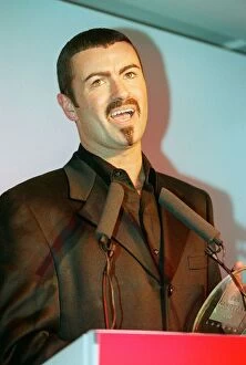 Images Dated 4th April 1996: George Michael the singer collects his award at the 'Help A London Child'