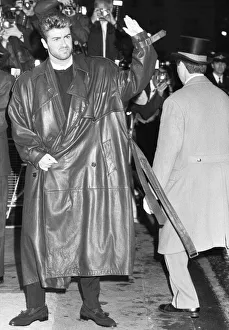 George Michael waves to fans outside the Savoy Hotel, where the launch party for his George Michael waves to fans outside the Savoy Hotel, where the launch party for his