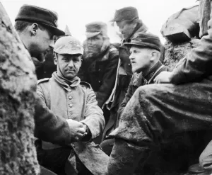A German soldier captured by the Belgian troops is given medical treatment to an injured A German soldier captured by the Belgian troops is given medical treatment to an injured