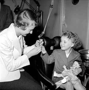 Girl in the Dentist's Chair at a Dental Clinic for children. 1954 Girl in the Dentist's Chair at a Dental Clinic for children. 1954